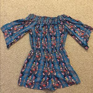 Romper with pockets off the shoulder if desired.